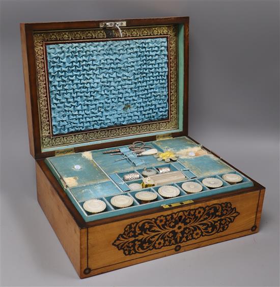 A 19th century marquetry sewing box with accessories